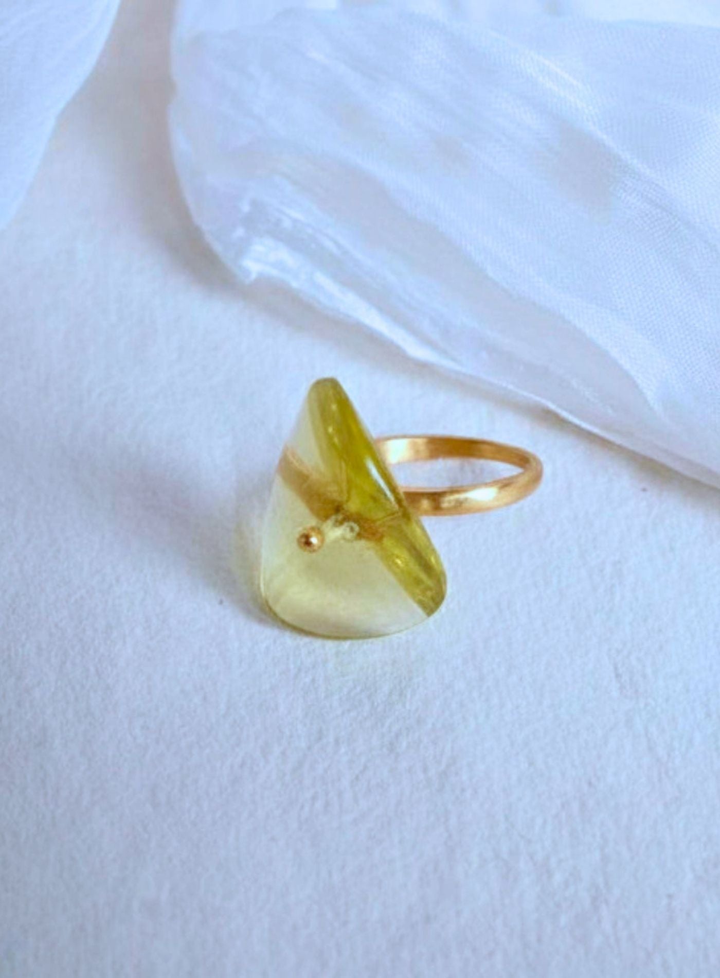 K18 yellow gold Infinity Ring featuring a hand-cut and hand-polished natural lemon quartz gemstone in a modern sculptural setting.