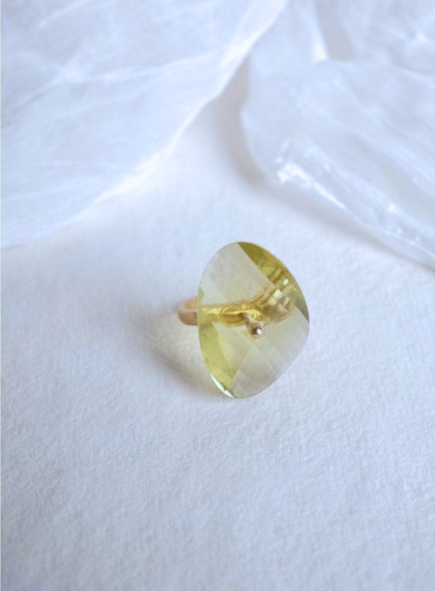 K18 yellow gold Infinity Ring featuring a hand-cut and hand-polished natural lemon quartz gemstone in a modern sculptural setting.