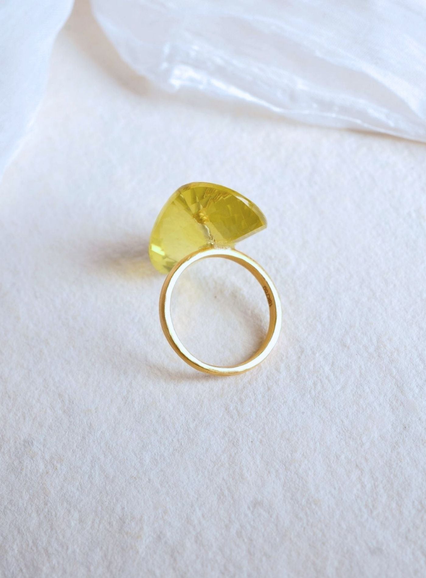 K18 yellow gold Infinity Ring featuring a hand-cut and hand-polished natural lemon quartz gemstone in a modern sculptural setting.